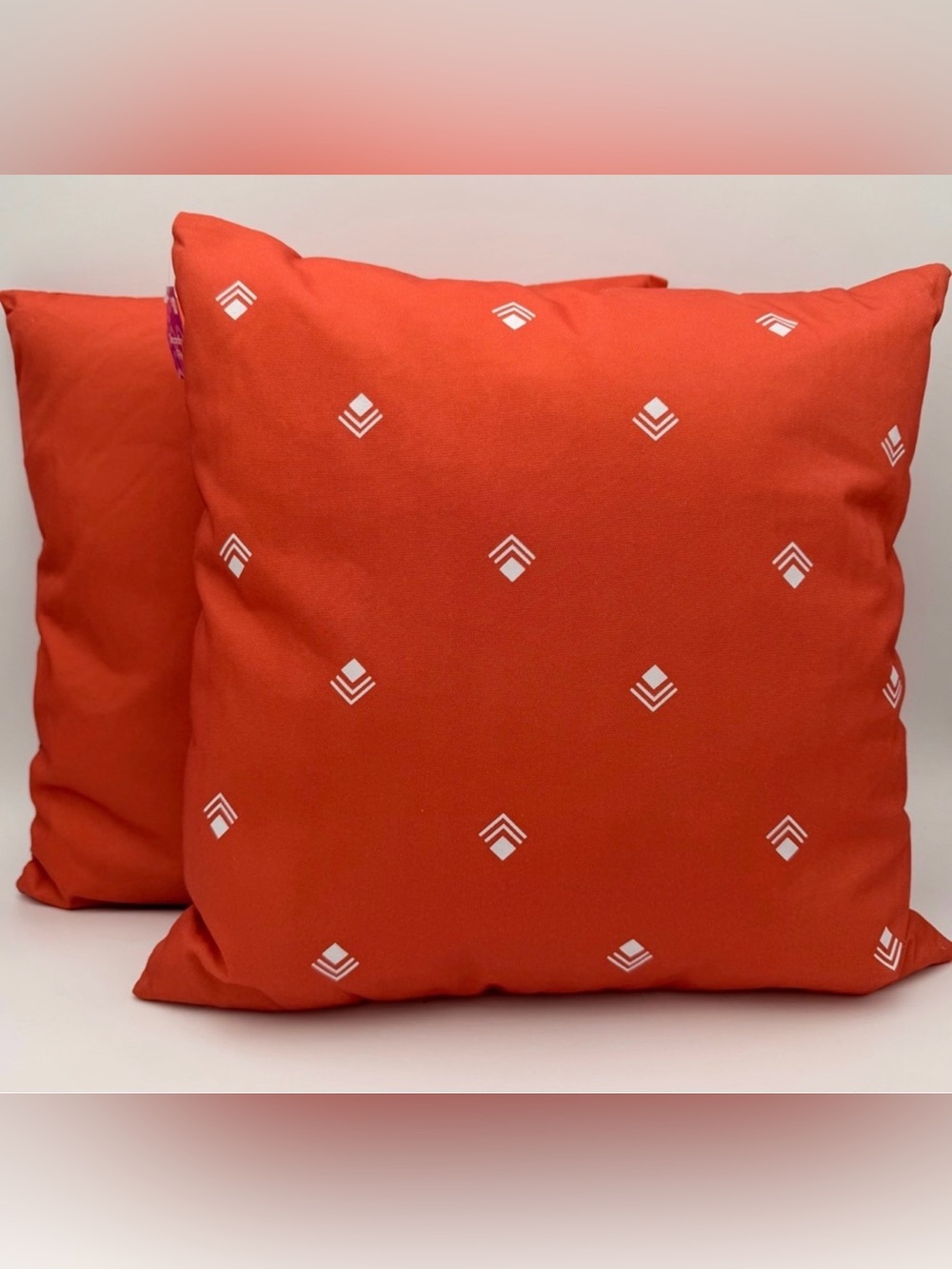 Set of 2 Orange Throw Pillows with White Geometric Pattern